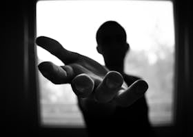 graphic design website development help is here hamburger design studio lisburn glasgow
Silhouette of a hand reaching out in a black and white contrast.